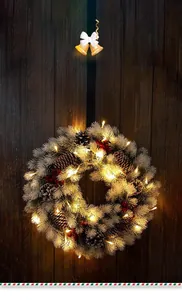 Detail view of snowy Christmas wreath with LED lights, pine cones, and red berries