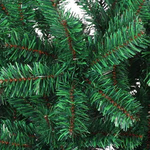 Close-up detail of dense PVC pine needles with natural green tones on a Christmas tree