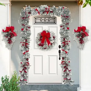 Christmas flocked garland and wreath set with red bows and berries for front door decor