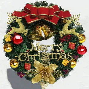 Christmas wreath with golden reindeer, red bows, and bells on a pine base decoration