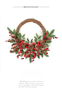 Close-up of Christmas pine cones, red berries and green pine needles on a woven wreath