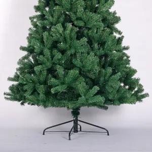 Detail of lush green PVC Christmas tree base with sturdy four-legged metal stand