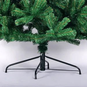 Detail of stable black metal folding stand and lush green PVC branches of the Christmas tree