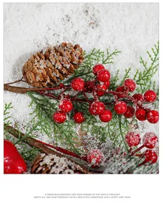 Close-up of snowy red Christmas berries, pine cones and needles for holiday decoration