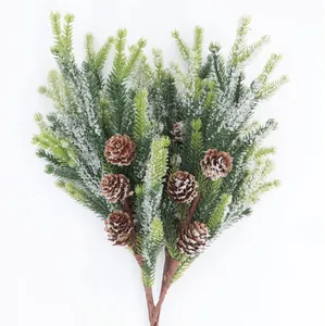 Detail of frosted pine needles and brown pine cones for Christmas tree decoration