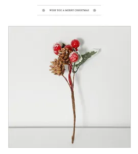 Detail of red berries, pine cones and frosted leaves for Christmas tree decoration