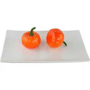 Set of two realistic orange foam mini pumpkins with green stems for Halloween decoration
