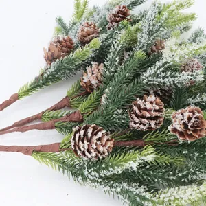 Artificial Christmas pine picks with natural pine cones and white flocked snow for decor