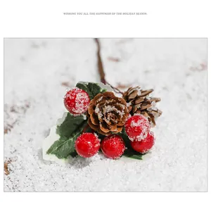 Detail of Christmas spray with red berries, natural pine cones and frosted pine needles
