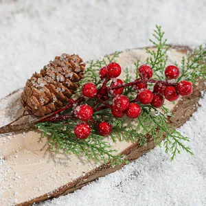 Artificial red berry sprig with pine cone and cedar leaves featuring faux snow texture