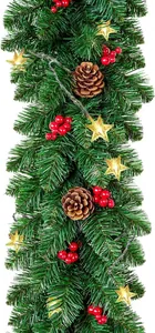 Detail of Christmas garland featuring red berries, pine cones and warm LED star lights