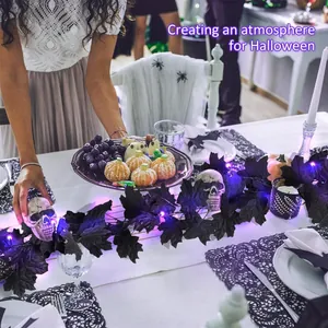 Halloween black maple leaf garland with purple LED lights and skull ornaments for table decor