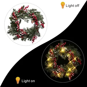Lighted Christmas wreath with pine needles and red berries in on and off modes