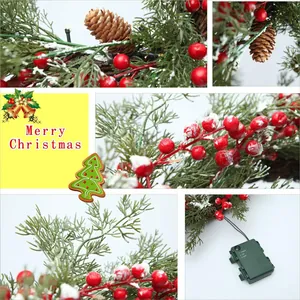 Artificial Christmas wreath with pine cones and red berries on a plain white background