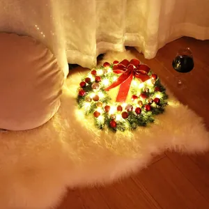 13-inch PE Christmas wreath with warm LED lights, red bows, and festive ornaments