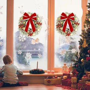 Set of 2 Christmas wreaths with red bows, pine cones, and warm LED lights for window decor