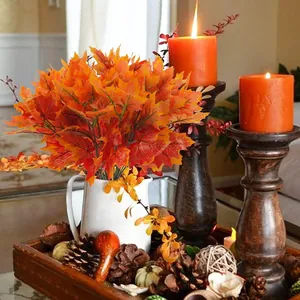 Artificial maple leaf branches in orange and yellow hues for autumn home table decor