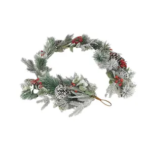 Frosted Christmas pine garland with red berries and pinecones on a white background