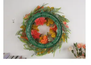 Rear view detail of autumn pumpkin wreath showing durable green plastic mounting base