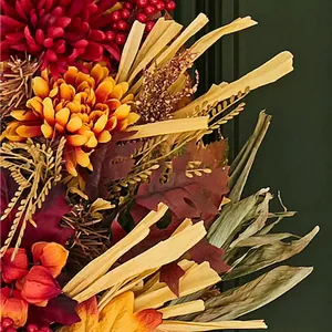 Artificial autumn wreath with red mums orange berries and fall leaves for front door decor