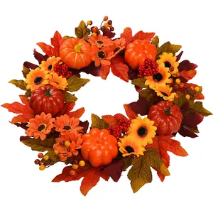 Autumn wreath with pumpkins, sunflowers, and maple leaves for Thanksgiving door decoration
