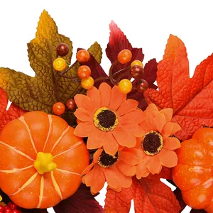 Autumn door wreath with orange pumpkins, sunflowers, and maple leaves on white background