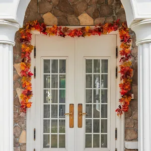 Vibrant autumn maple leaf garland draped over white doors for seasonal festive decor