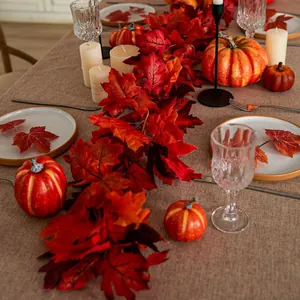Artificial autumn maple leaf garland with pumpkins for Thanksgiving table decor