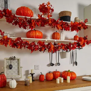 Autumn maple leaf garlands and various pumpkins set for Thanksgiving home decor