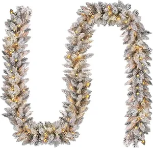 Close-up of 9ft flocked Christmas garland with warm LED lights for fireplace decor