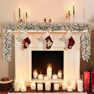 9ft flocked Christmas garland with warm LED lights and festive stockings on fireplace