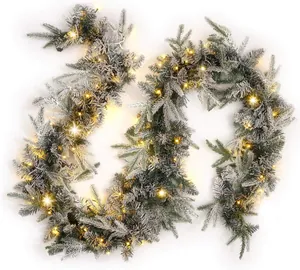 Close-up of 6.3FT flocked Christmas garland with warm LED lights on pine needles