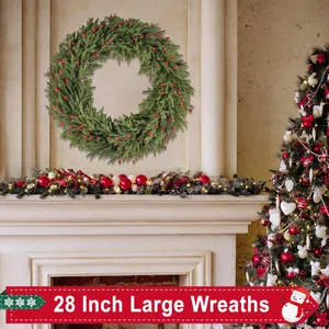Close-up of 28 inch Christmas wreath with red berries and pine cones on a fireplace