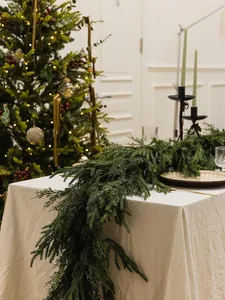 Detail of 6ft Norfolk pine garland draped over table edge for festive home decor