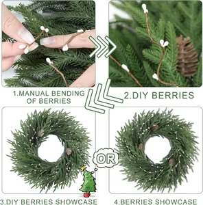 Détail de couronne de Noël DIY montrant des tiges de baies flexibles et aiguilles de pin