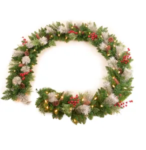 Detail of 72 inch Christmas garland with pine needles, red berries and warm LED lights