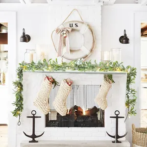 Close-up of 1.8m pre-lit Christmas garland with white berries and knitted stockings