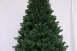Detailed close-up of realistic green artificial PE Christmas tree with dense needles