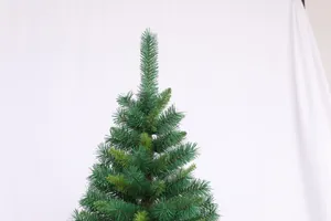 Detail of green PVC Christmas tree top with layered needle textures and realistic branches
