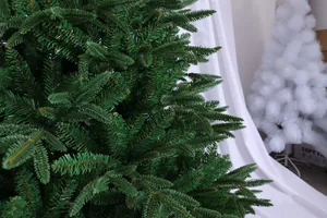 Close-up detail of realistic green PE and PVC artificial Christmas tree needle branches