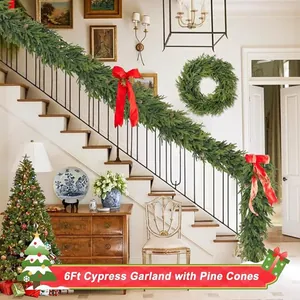 6ft Norfolk Pine garland with natural pine cones and red bows for Christmas stair decor