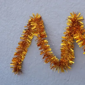 Sparkling gold tinsel garland for festive Christmas and wedding party decorations