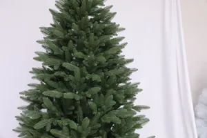 Close-up of high-quality PE needles on a realistic artificial dark green Christmas tree