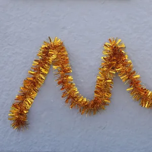 Golden tinsel garland for wedding party decoration and festive Christmas celebrations