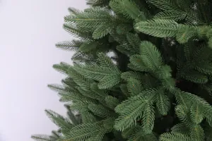 Detailed macro view of high-quality green PE needle foliage on an artificial Christmas tree