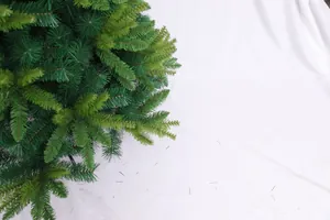 Detailed close-up of dense mixed PVC pine needles on an artificial Christmas tree