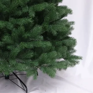 Lush dark green PE artificial Christmas tree with a sturdy black metal folding stand