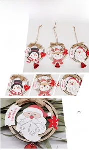 Detailed view of wooden Christmas ornaments featuring Santa, reindeer and snowman designs