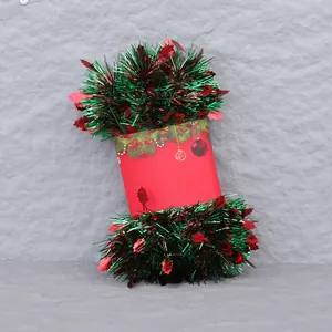 Close-up of red and green tinsel garland with metallic shine for Christmas party decor