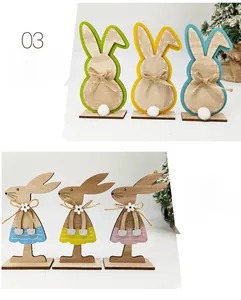 Detailed view of wooden Easter bunny ornaments with jute bows and stable rectangular bases